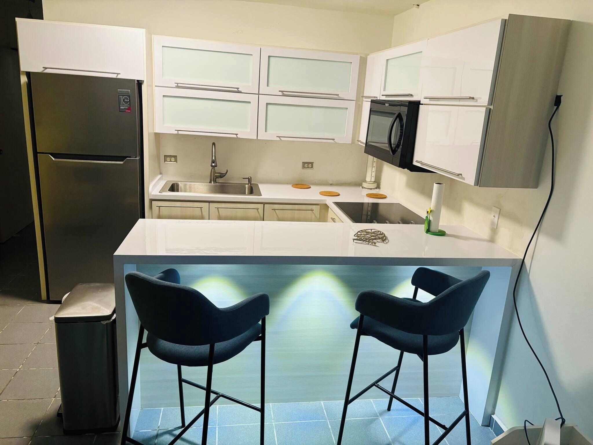 Fridge, microwave, stovetop, coffee/tea maker