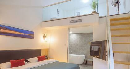 Heinemann Hotel loft suite with two king beds A306— with a jacuzzi and a local