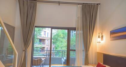 Heinemann Hotel loft suite with two king beds B306— with a jacuzzi and a local