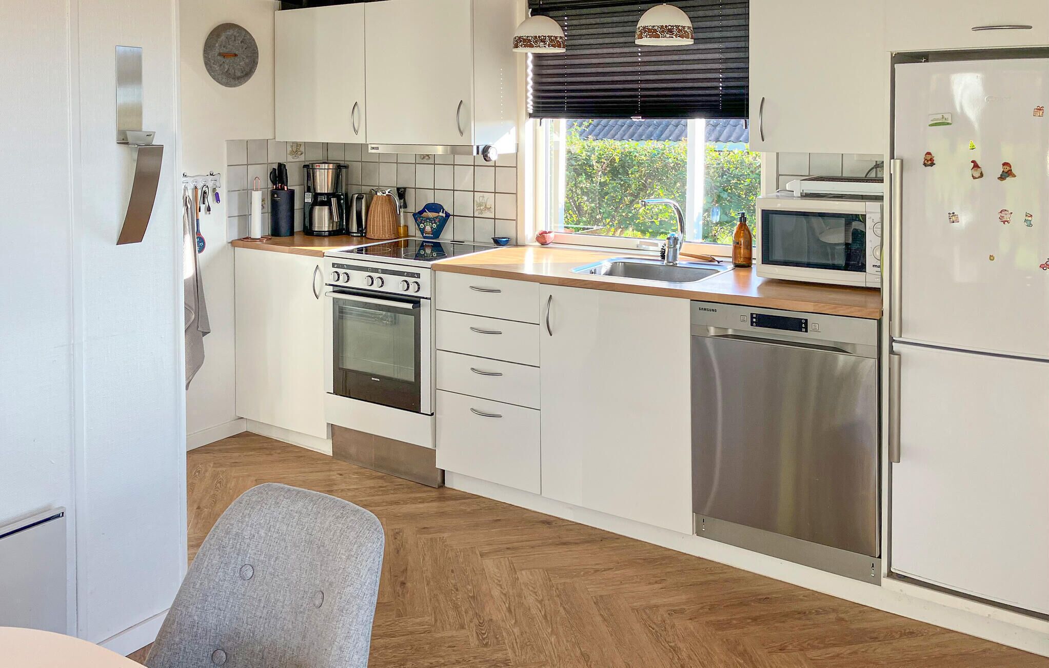 Fridge, stovetop, dishwasher, coffee/tea maker