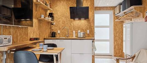 Fridge, stovetop, coffee/tea maker, electric kettle