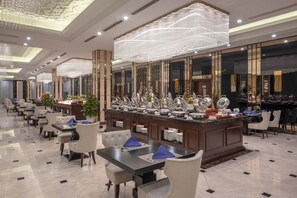 A spacious hotel lobby with a long reception desk, multiple seating areas, and a decorative ceiling. - MeliĆ” Vinpearl Hai Phong Rivera (Hai Phong Municipality)