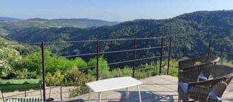 Stone house with swimming pool with whirlpool and patio with terrace on the valley