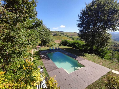 Stone house with swimming pool with whirlpool and patio with terrace on the valley