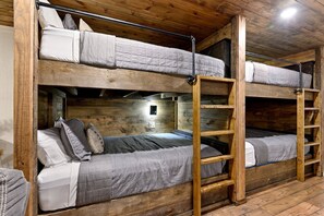 A bunk bed room with wooden walls and a ladder. - Wonderful Cabin Perfect for Family Getaways in Broken Bow, Oklahoma (Broken Bow)