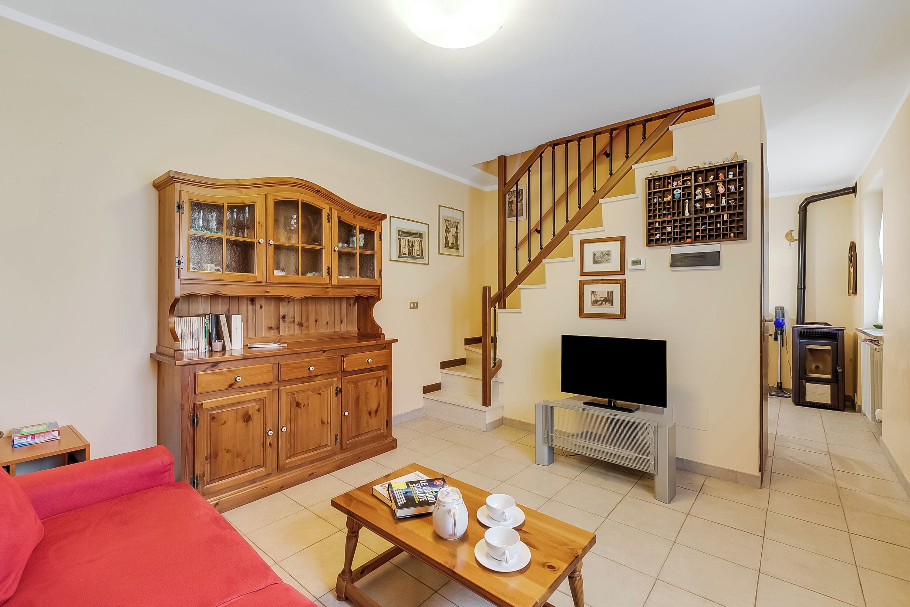 Family House, Multiple Bedrooms (Maison Dolce Vento) | Living area | 21-inch flat-screen TV with cable channels