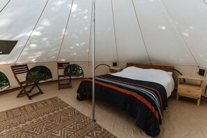 A tent with a bed, two chairs, a small table, and a rug. - Large and Spacious Double Bell Tents Great for Families in Carson, Washington (Carson)