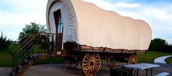 Perfect Glamping Vacations in this Rustic Conestoga Covered Wagon Rental in Oklahoma