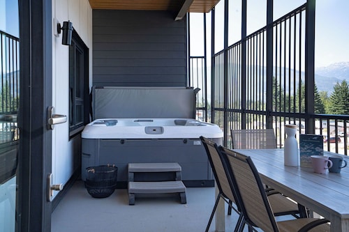 Relax in this 2-bedroom, 2-bath vacation home in Mackenzie Village, featuring a full-size hot tub—perfect for unwinding after a day of adventure.