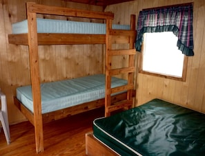 A bunk bed room with a window and a curtain. - Fantastic Cabin with Fire Pit Close to West Yellowstone, Montana (West Yellowstone)