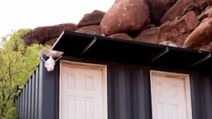 A metal building with two white doors and a small white object on the left side. - Intimate Glamping Tent near Arches National Park for a Memorable Couples Escape in Moab, Utah (Moab)