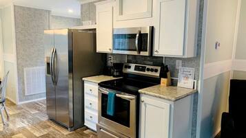 Fridge, microwave, stovetop, coffee/tea maker