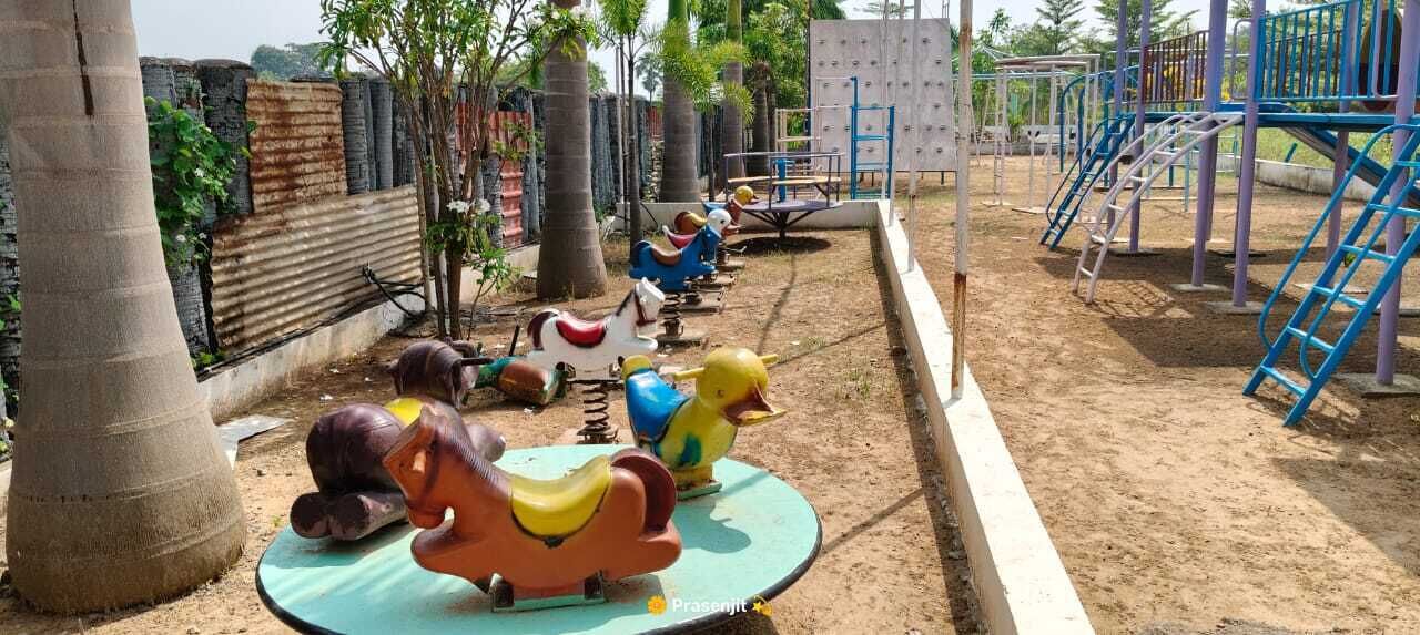A playground with swings and a slide.