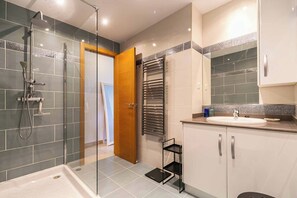 Shower, hair dryer, towels, toilet paper
