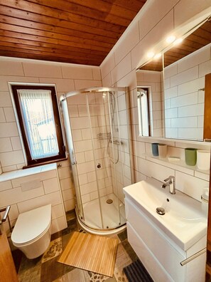 Shower, hair dryer, towels, soap