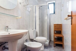 Apartment, 1 Bedroom, Partial Sea View | Bathroom | Shower, hair dryer, towels, soap