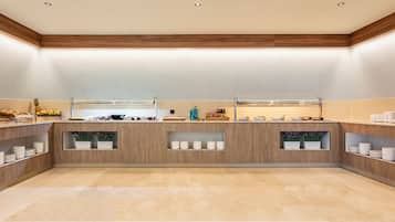 A modern kitchen with wooden cabinetry, a central island, and built-in shelves.