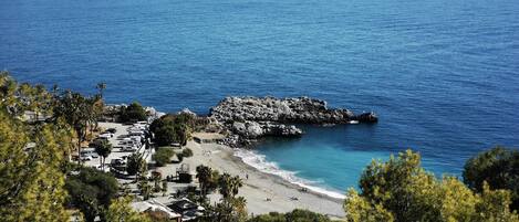 On the beach, sun-loungers