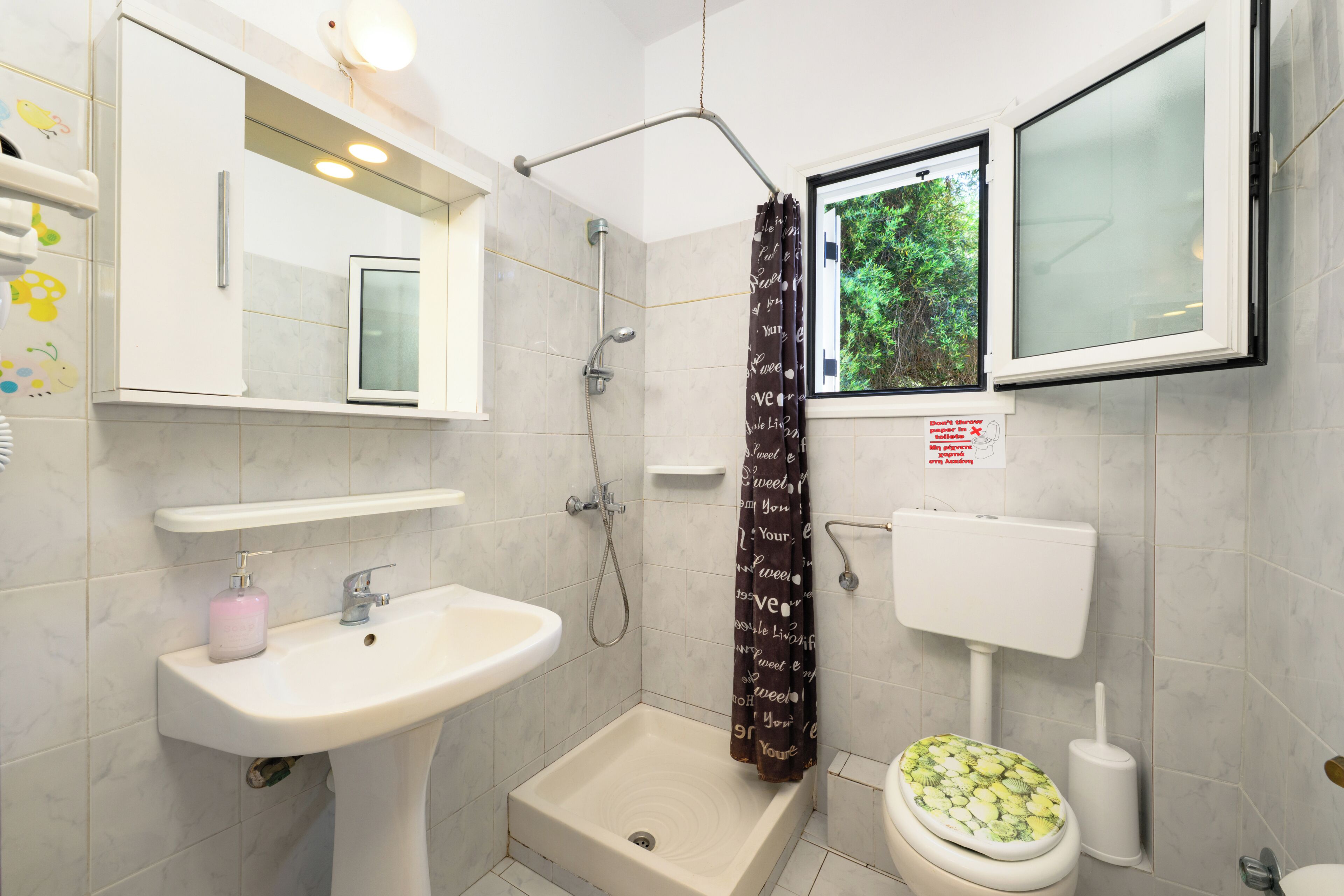 Apartment, Sea View | Bathroom | Shower, hair dryer, towels