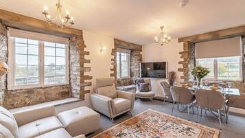 Family Apartment, 3 Bedrooms, Non Smoking, River View | Living area | Flat-screen TV