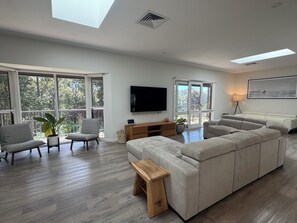 Smart TV, fireplace, table football, books