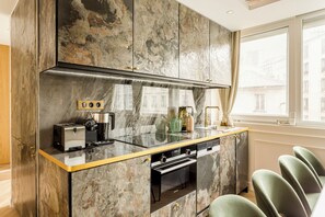 Apartment, City View | Private kitchen | Fridge, microwave, oven, stovetop - Merveil Luxury Suite - Eiffel Fremicourt (Paris)