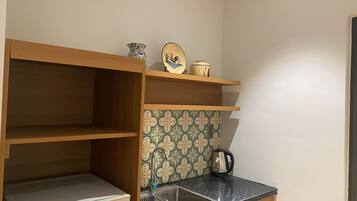 Standard Apartment | Private kitchen | Mini-fridge, microwave, stovetop, cookware/dishes/utensils