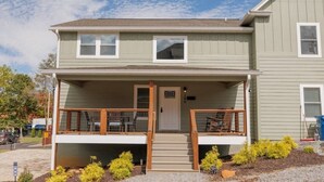 A two-story building with a covered porch and a front door. - Mabel's Place - 3BR, 2.5BA, Newly Renovated Duplex (Waynesville)