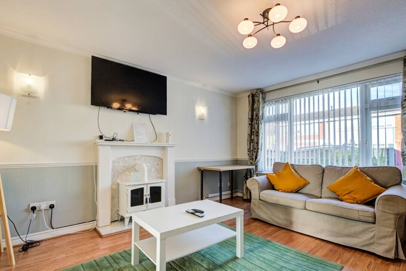 TV, fireplace, books