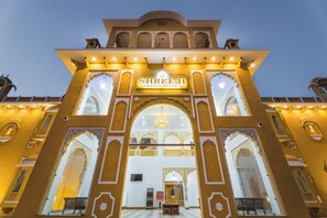 The entrance of Shri Jee Desert Resort with ornate arches and a sign above the doorway. - Shreeji Desert Resort (Sam)
