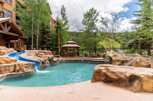 Slope-Side Luxury Condo - Pool with Slide, Hot Tubs, & More!