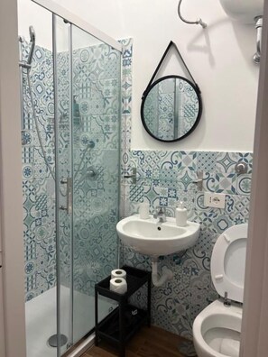 Shower, free toiletries, hair dryer, towels