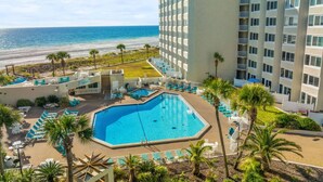 A hotel with a pool, beach view, and multiple floors. - Renovated Beach Front Ocean View Condo TOG 723 (Panama City Beach)