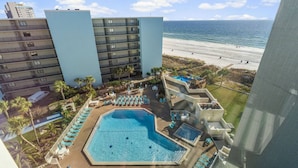 A hotel with a pool, beach view, and multiple floors. - Sea the Gulf - Top of the Gulf 809 - Luxury Resort (Panama City Beach)