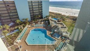 A hotel with a pool, beach view, and multiple floors. - Top of the Gulf 421 - Luxury Beach View Condo (Panama City Beach)