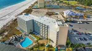 A hotel with a pool, beach access, and parking. - Top of the Gulf 320 Beachfront Free Beach Chairs (Panama City Beach)