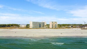 A beachfront hotel with multiple buildings, a sandy beach, and the ocean. - Beachfront Studio Condo - Top of the Gulf 317 (Panama City Beach)