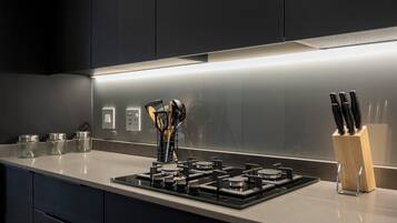 Deluxe Studio, Balcony, City View | Private kitchen | Full-sized fridge, microwave, oven, stovetop