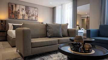 Deluxe Studio, Balcony, City View | In-room safe, desk, laptop workspace, iron/ironing board