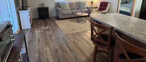 A compact living space with a kitchen, dining area, and seating area.