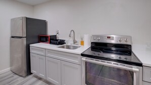 A kitchen with a stainless steel refrigerator, microwave, sink, stove, and oven. - 2 Mi to Umd: Apt w/ Free Parking in Silver Spring! (Silver Spring)