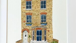 A two-story building with a brick facade, a central bay window, and a door with a small porch. - Herne Hill Haven (London)