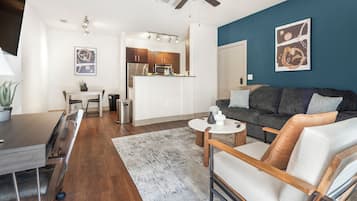 Standard Apartment (1 Bedroom) | Living area | 50-inch Smart TV with digital channels
