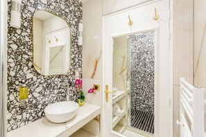 Apartment, Courtyard View | Bathroom | Shower, rainfall showerhead, eco-friendly toiletries, hair dryer