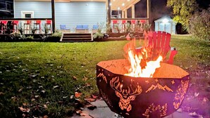 A modern house with a fire pit in the yard. - Scenic year round cabin at Lac La Nonne (Lac Ste Anne county)