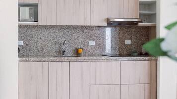 Suite, Balcony, Sea View | Private kitchen | Fridge, microwave, cookware/dishes/utensils