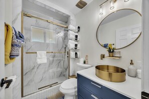 Shower, hair dryer, towels, soap