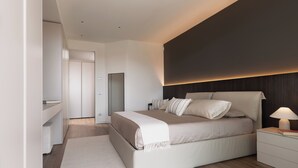 Une chambre moderne avec un grand lit, des tables de chevet, une commode et un miroir.