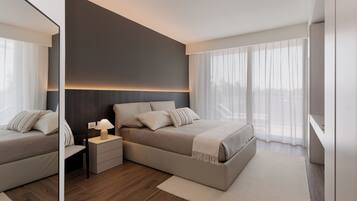 Apartment, 1 Bedroom, Kitchen, City View | Desk, laptop workspace, blackout drapes, iron/ironing board