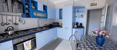 Fridge, microwave, stovetop, coffee/tea maker